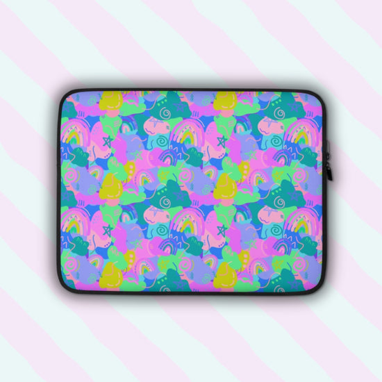 The Funfetti Laptop Sleeve by My Favourite Colour is Rainbow features a vibrant design of pink, green, blue, and purple rainbows, swirls and abstract shapes.  The print is on only one side of the laptop sleeve, the other side is black.