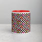 The Galaxy Mug by My Favourite Colour is Rainbow is a ceramic cylinder with a checkered design featuring stars, hearts, rainbows, and various shapes in black, white, pink, green, and yellow on a red interior. This colorful mug sits elegantly on a light gray surface.