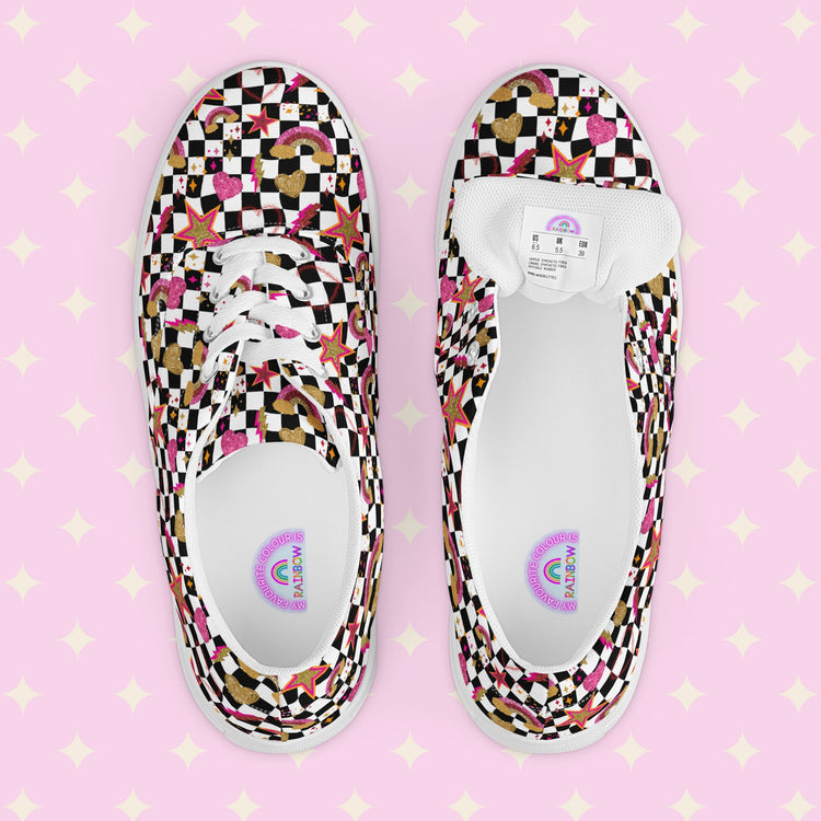 A top view of My Favourite Colour is Rainbows Galaxy Canvas Sneakers, decorated with a black and white checkerboard print, featuring gold, pink and red stars, hearts and rainbows.  They are complemented by white laces and soles.  The underside of the shoe tongue has a shoe size sticker and the inside of the shoe is white with My Favourite Colour is Rainbow branding on the footbed.
