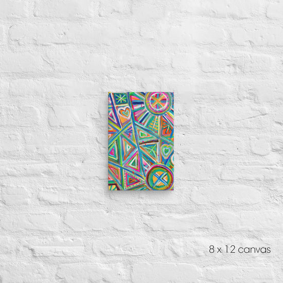 A 8x12 Geometric Rainbow canvas by My Favourite Colour is Rainbow, featuring vibrant triangles, hearts and circles in pink, blue, green, and orange, is mounted on a textured white background.