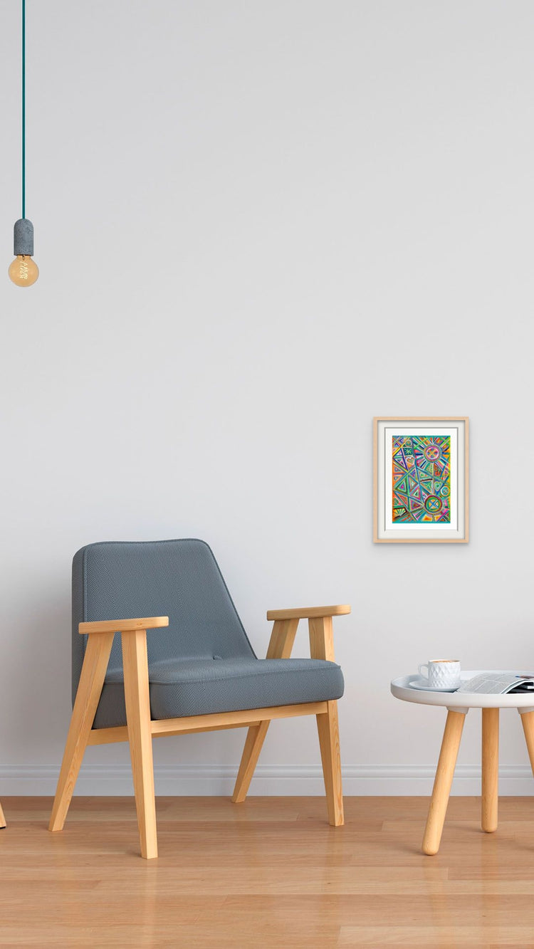 Minimalist room with a modern gray armchair, small round white table, and vibrant Geometric Rainbow Fine Art Prints by My Store on the wall. A hanging light bulb completes the style on the wooden floor, with each print including a certificate of authenticity.