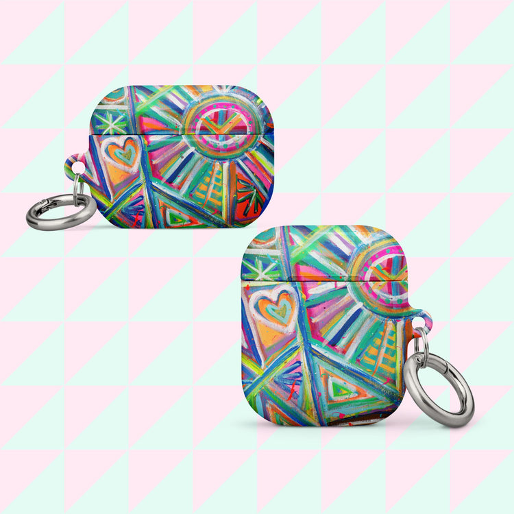 Two abstract AirPods cases by My Favourite Colour is Rainbow feature geometric rainbow patterns and heart motifs. Each case comes with a silver keychain against a pastel pink and green checkered background.