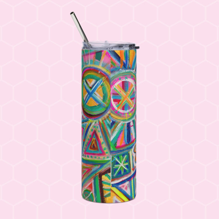 The Geometric Rainbow Stainless Steel Tumbler by My Favourite Colour is Rainbow features a tall, cylindrical shape with a silver straw and displays circles and triangles in vibrant pink, blue, green, and yellow on a light pink hexagonal grid—perfect for stylishly eco-friendly sipping.