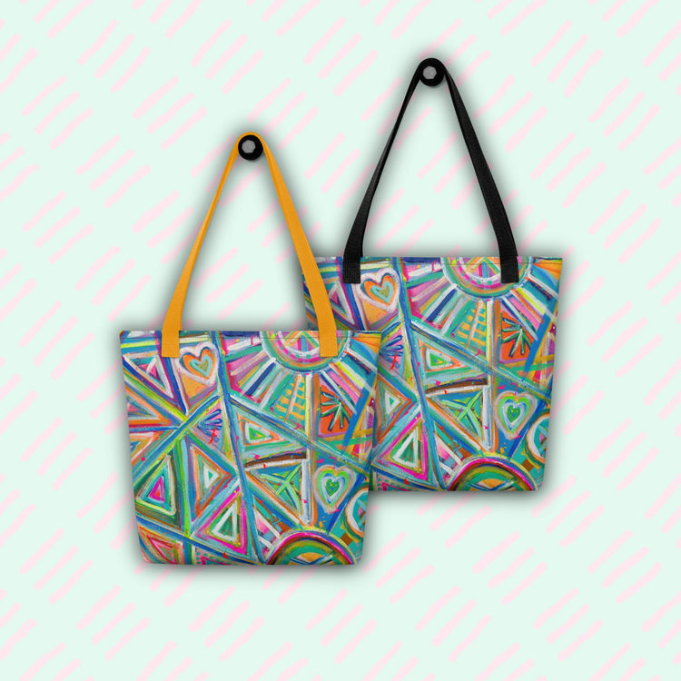 The Geometric Rainbow Tote Bags by My Favourite Colour is Rainbow feature vibrant geometric and heart patterns. One bag boasts yellow straps, the other black, both hanging from hooks.