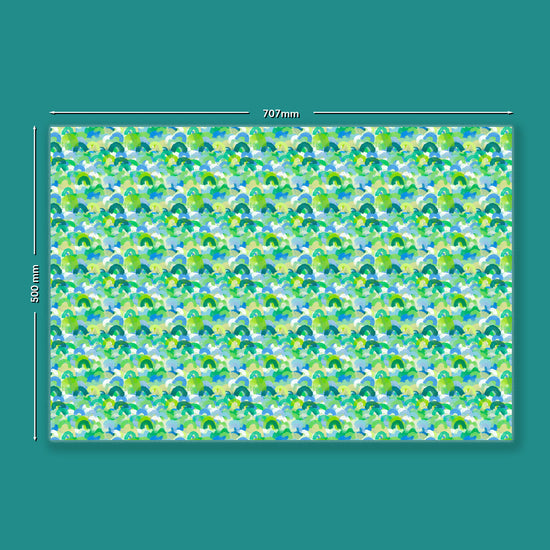 The Green Rainbow Wrapping Paper by My Favourite Colour is Rainbow measures  707mm x 500mm and features an abstract pattern of watercolour brushstrokes resembling rainbows, in shades of green and blue.