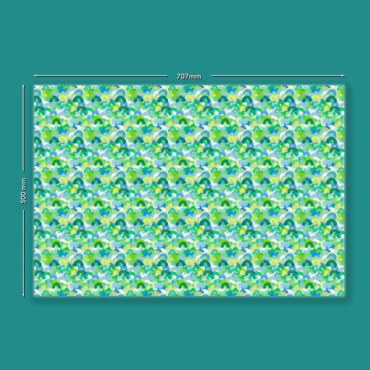 The Green Rainbow Wrapping Paper by My Favourite Colour is Rainbow measures  707mm x 500mm and features an abstract pattern of watercolour brushstrokes resembling rainbows, in shades of green and blue.