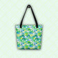 The Green Rainbow Tote Bag by My Favourite Colour is Rainbow hangs against a light green background with diagonal white stripes. This colourful tote features black handles and a green and blue watercolour rainbow design.