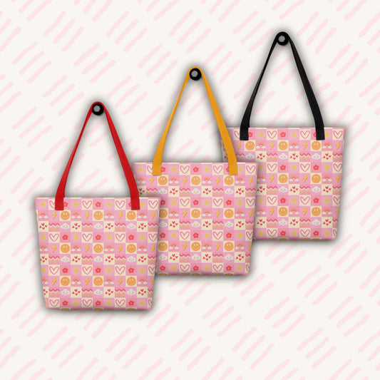 Three Happy Smiles Sunny Days Tote Bags by My Favourite Colour is Rainbow hang on hooks, with red, yellow and black handles. The bags feature a pattern of pink, red and yellow smiley faces, lightning bolts, clouds, suns, hearts, flowers, and geometric shapes.