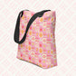 The Happy Smiles Sunny Days Tote Bag by My Favourite Colour is Rainbow is a pink tote with black handles and a playful pattern of smiley faces, lightning bolts, clouds, suns, hearts, flowers, and geometric shapes. Its spacious interior complements the pink stripes on the light background perfectly.