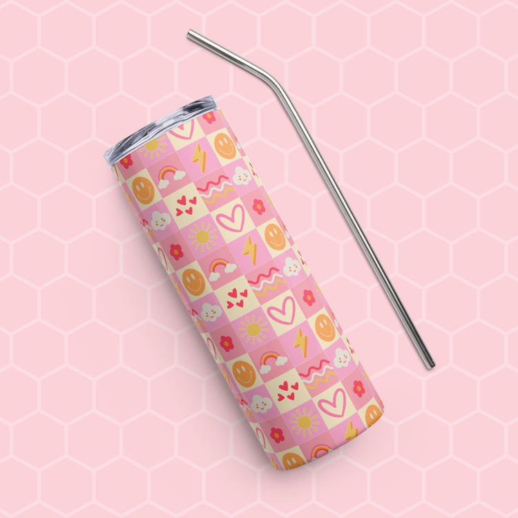 The Happy Smiles Sunny Days Stainless Steel Tumbler by My Favourite Colour is Rainbow displays a pastel pink and yellow pattern with smiley faces, hearts, flowers, clouds, and lightning bolts on a pink hexagonal background and comes with a sleek metal straw.