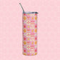 The Happy Smiles Sunny Days Stainless Steel Tumbler by My Favourite Colour is Rainbow features a metal straw and a vibrant design of smiley faces, hearts, clouds, suns, and lightning bolts in pink, yellow, and orange on a pink hexagonal background. Ideal for style-conscious tumbler users.