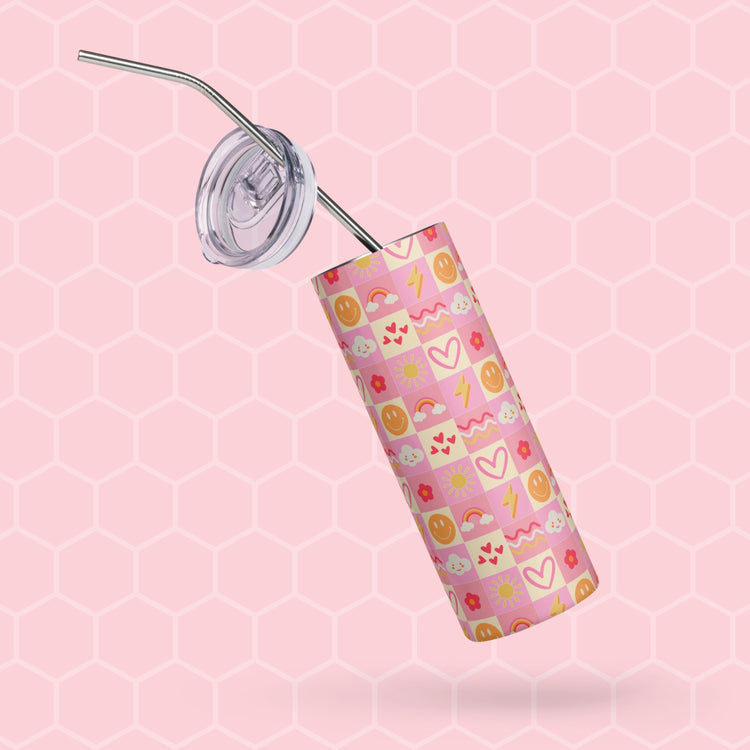 The Happy Smiles Sunny Days tumbler by My Favourite Colour is Rainbow features emojis, hearts, and lightning on a pink honeycomb background, includes a metal straw and an angled clear plastic lid.