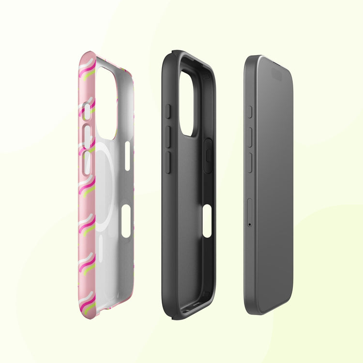 Three smartphone accessories on a light background: an Iced Vovo MagSafe iPhone case by My Favourite Colour is Rainbow displaying a pink pattern, a solid black dual-layer case, and a smartphone with a dark screen. Each item is vertical, showcasing design details and MagSafe-compatible openings.