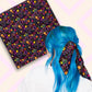 Two views of the 'In the Midnight Garden' Bandana by My Favourite Colour is Rainbow.  At top left, a flat lay of the bandana.  At bottom right, a person with vibrant blue hair is seen from behind, wearing the 'In the Midnight Garden' Bandana in her hair.