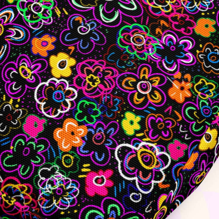 The In the Midnight Garden Mini Crossbody Bag from My Favourite Colour is Rainbow features a vibrant abstract floral print on a black background, with pink, orange, yellow, green, and blue flowers overlapping to create a lively and dynamic design.