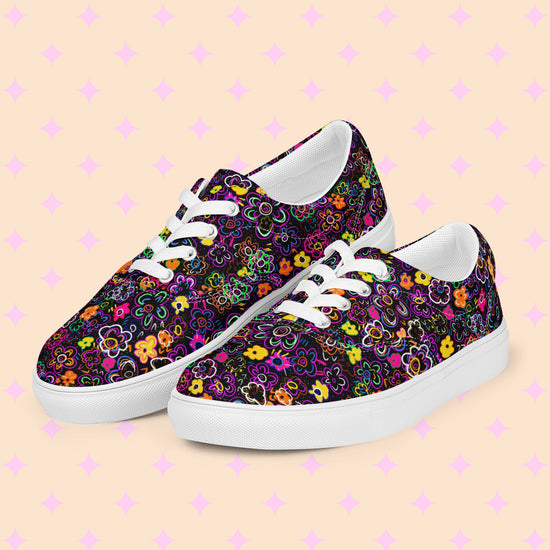 The In the Midnight Garden canvas sneakers by My Favourite Colour is Rainbow feature a vibrant floral print on black, white laces and soles and breathable lining for comfort.