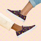 Two pairs of feet wear matching In the Midnight Garden canvas sneakers from My Favourite Colour is Rainbow. One person sports light pants, the other rolled-up jeans.  