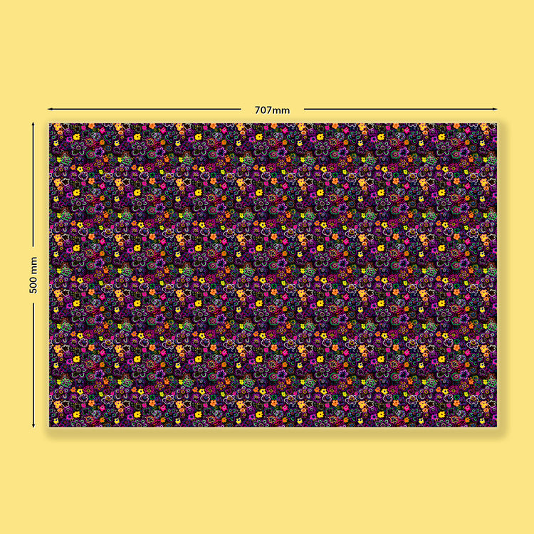 The In the Midnight Garden Wrapping Paper Sheet by My Favourite Colour is Rainbow features dense neon flowers on a dark purple background, measuring 707mm x 500mm. Displayed on a solid yellow surface, dimensions are marked by arrows, making it perfect for wrapping gifts.