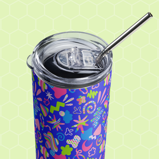 The Neon Carnival Stainless Steel Tumbler by My Favourite Colour is Rainbow showcases an artistic abstract design in pink, green, and blue on a light green hexagonal background. It includes a clear lid and a sleek metal straw.