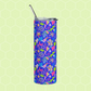 The Neon Carnival Stainless Steel Tumbler by My Favourite Colour is Rainbow, featuring a vibrant pattern of abstract shapes in blue, green, pink, and white.  It has a metal straw, and is set against a light green background.