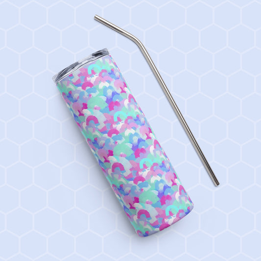 The Pastel Rainbow Stainless Steel Tumbler by My Favourite Colour is Rainbow, featuring a colorful abstract pattern in purple, blue, pink, and green hues, rests on a light blue hexagonal background with a sleek metal straw beside it.