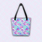 The Pastel Rainbow Tote Bag by My Favourite Colour is Rainbow features watercolour pastel rainbows in shades of blue, purple, pink, and teal.  The bag has black handles and hangs on a hook.