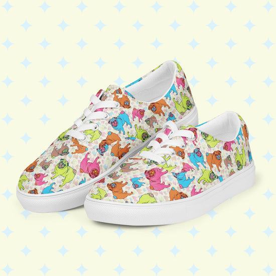 The Pugalicious Canvas Sneakers by My Favourite Colour is Rainbow feature a vibrant cartoon pug pattern in green, blue, pink, and orange. Set on a light yellow background with blue diamond designs, these lace-up shoes offer a breathable lining for ultimate comfort.