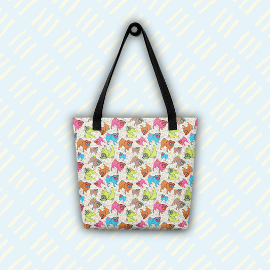 The Pugalicious Tote Bag by My Favourite Colour is Rainbow is showcased on a light blue background with yellow diagonal lines.  The tote features black handles and a stylish cartoon-style pug pattern in pink, blue, green, red, and brown.