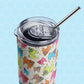 The Pugalicious Stainless Steel Tumbler by My Favourite Colour is Rainbow, features a vibrant cartoon pug design in pink, blue, green, and orange hues. It comes with a metal straw and sits against a honeycomb-patterned background.