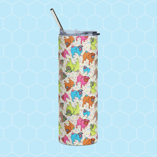 Pugalicious Stainless Steel Tumbler by My Favourite Colour is Rainbow features a tall design with lid, metal straw, and colorful cartoon dogs on a vibrant pink, green, blue, and orange hexagonal patterned background.