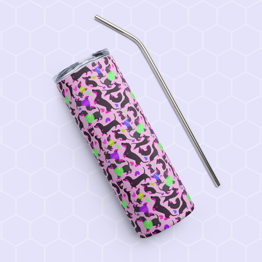 The Silly Sausages Stainless Steel Tumbler from My Favourite Colour is Rainbow, showcasing an abstract pattern with purple, green, and pink shapes, rests beside a metal straw on a light hexagonal-patterned surface.