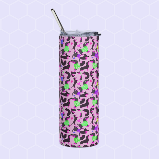 The Silly Sausages Stainless Steel Tumbler by My Favourite Colour is Rainbow features a playful pink, purple, and green design of cats in scarves and hats, complemented by a metal straw on a light hexagonal pattern background.