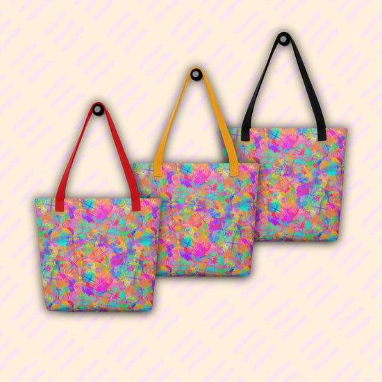 Three Splotches and Crosses Tote Bags by My Favourite Colour is Rainbow hanging on hooks, showing red, yellow and black handles.  The bags feature an abstract pattern of pink, blue, green, and orange splashes.