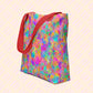 The Splotches and Crosses Tote Bag by My Favourite Colour is Rainbow features an abstract pattern of pink, blue, green, and orange splashes.  This version has red straps.