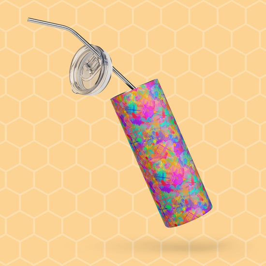 The Splotches and Crosses Stainless Steel Tumbler by My Favourite Colour is Rainbow features an abstract mosaic pattern, a metal straw, a clear plastic lid, and a subtle light honeycomb background.