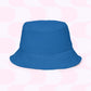 On a pink and white geometric background, the Squiggs and Stripes Reversible Bucket Hat from My Favourite Colour is Rainbow showcases a classic wide-brimmed design in blue. Available in multiple sizes, its the ideal Style BFF for any outfit.