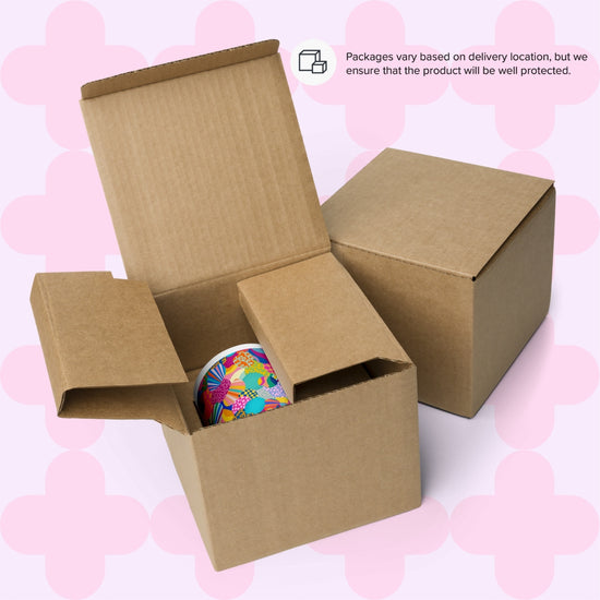 An open box reveals the colourful Squiggs and Stripes Mug from My Favourite Colour is Rainbow. A closed box sits beside it. The text above states, Packaging may change by location, but we promise your product will be well protected. The background is light pink.