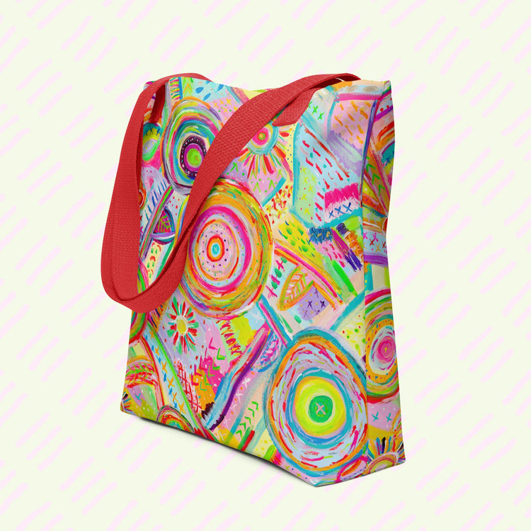 The Summer Sorbet Tote Bag by My Favourite Colour is Rainbow features my Summer Sorbet painting: vibrant abstract designs of circles and geometric shapes in bright pink, orange, blue, and green. This version features red handles.