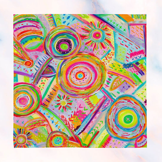 The Mixed Set of 4 Art Napkins by My Favourite Colour is Rainbow pairs beautifully with a vibrant abstract painting featuring overlapping circles in pink, green, and yellow hues against a dynamic geometric background—perfect for upgrading your dining space.