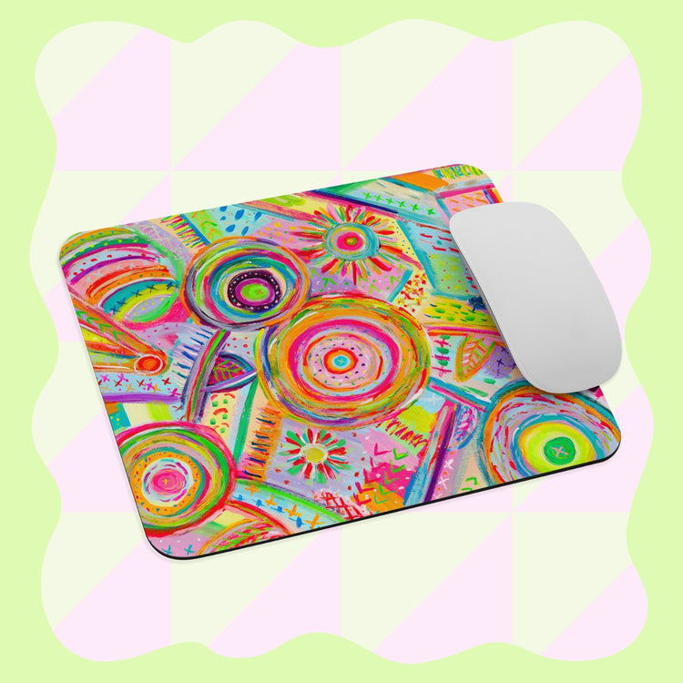 The Summer Sorbet Mouse Pad by My Favourite Colour is Rainbow features abstract circular and geometric patterns in vibrant hues, set against a soft green and pink checkered background, complemented by a simple white mouse.