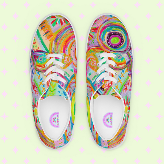 Embrace the Summer Sorbet vibe with My Favourite Colour is Rainbows canvas sneakers, featuring psychedelic, abstract designs in vibrant pink, green, orange, and blue. The pale green backdrop with whimsical pink cross patterns adds charm to this lively style.