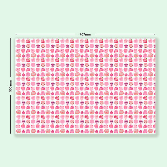 Sweet Treats Wrapping Paper Sheets by My Favourite Colour is Rainbow features  illustrations of decorated birthday cakes and desserts in shades of pink with green accents.  Dimensions: 707mm x 500mm.