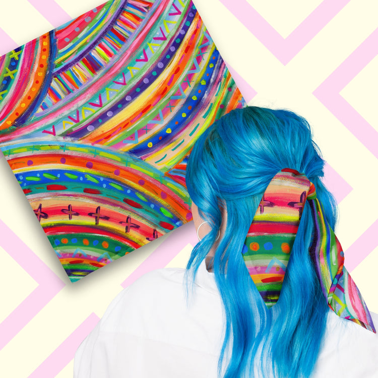 Two views of the 'The Rainbow Connection' Bandana by My Favourite Colour is Rainbow.  At top left, a flat lay of the bandana.  At bottom right, a person with vibrant blue hair is seen from behind, wearing the bandana in her hair.