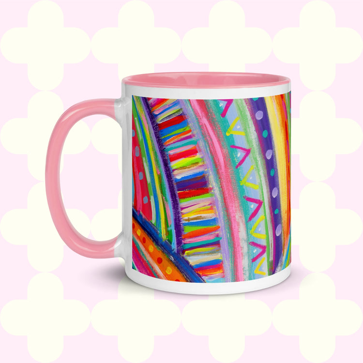 The Rainbow Connection Mug by My Favourite Colour is Rainbow features intricate patterns of stripes, dots, and zigzags in vibrant pink, blue, green, and yellow. It features a pink handle and inner rim .