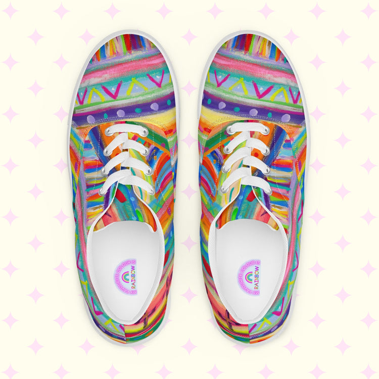 Unleash a colorful adventure with The Rainbow Connection Canvas Sneakers by My Favourite Colour is Rainbow, showcasing intricate geometric patterns in vibrant pink, orange, blue, green, and yellow with white laces and soles on a light backdrop adorned with pink diamond shapes.