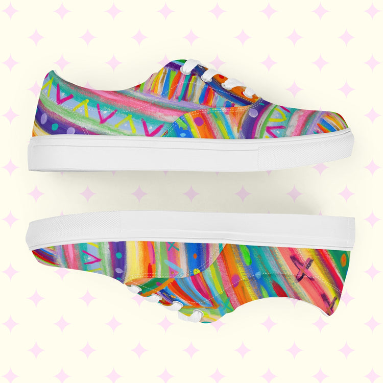 The Rainbow Connection Canvas Sneakers by My Favourite Colour is Rainbow feature abstract rainbow geometric patterns on a pale yellow background with playful pink star motifs.