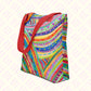 The Rainbow Connection Tote Bag from My Favourite Colour is Rainbow features vibrant abstract patterns in rainbow hues with red handles and a spacious design.