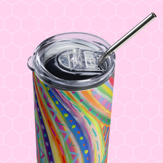 The Rainbow Connection Stainless Steel Tumbler by My Favourite Colour is Rainbow showcases colorful abstract stripes and patterns against a pink hexagonal background, with a transparent lid and sleek metal straw.