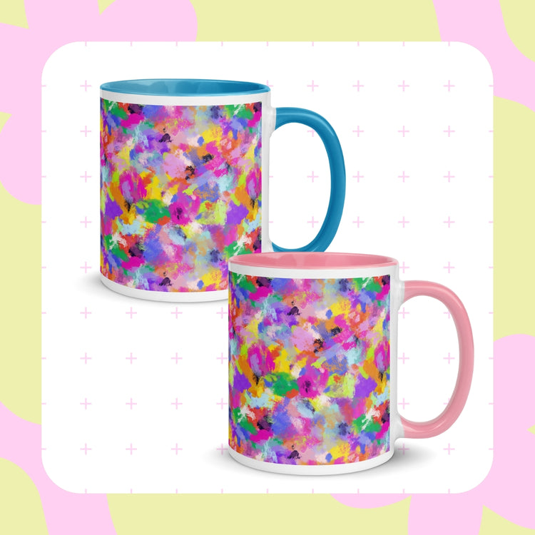 Against a backdrop of pastel shapes and crosses, two Watercolour Rainbow Mugs from My Favourite Colour is Rainbow are displayed. One features a blue handle and interior, while the other has a pink handle and interior.