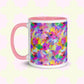 The Watercolour Rainbow Mug by My Favourite Colour is Rainbow features a pink handle and inner rim, displaying an abstract, vibrant design in shades of pink, purple, yellow, green, and blue.